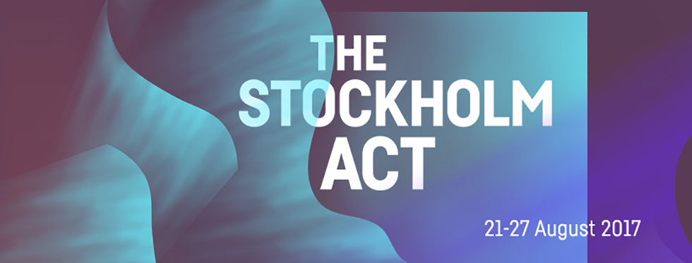 Turkosa vågformationer med texten The local act i vita versaler ovanpå