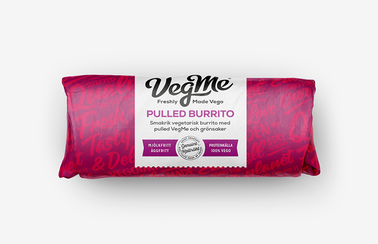 En burritorulle i rosa papper med texten VegMe på