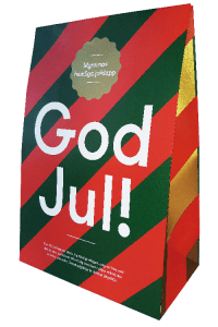 Presentförpackning i grönt och rött med texten God Jul! i vitt